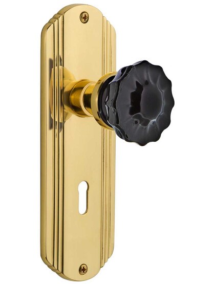 Streamline Deco Mortise Lock Set with Colored Fluted Crystal Glass Knobs Black in Un-Lacquered Brass.